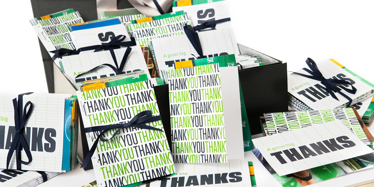 Thank you letters on a desk