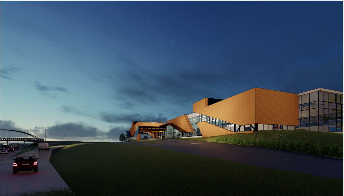 a concept image of a large Protoplex building next to the main university offramp
